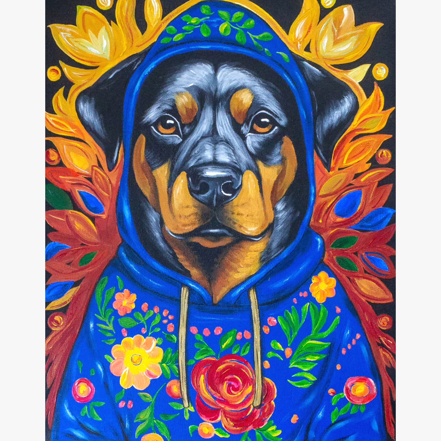 A vibrant acrylic painting of Buster, a confident Rottweiler wearing a richly decorated blue floral hoodie. The warm autumnal hues surrounding him create a regal yet contemporary feel, with golden leaves framing his strong, attentive gaze. The bold colors and intricate patterns give this piece a striking presence.