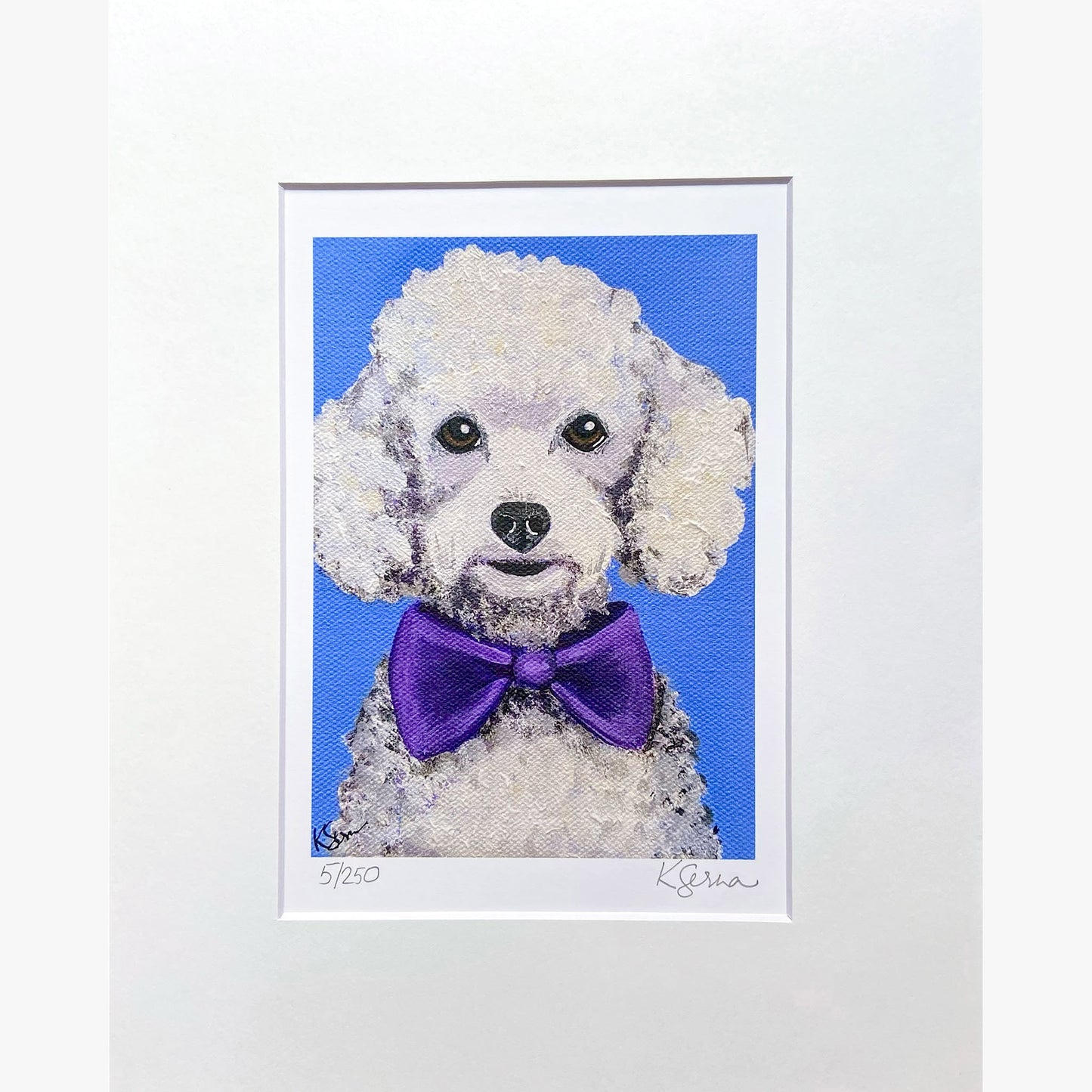 Framed artwork of a dog wearing a purple bow tie on a blue background