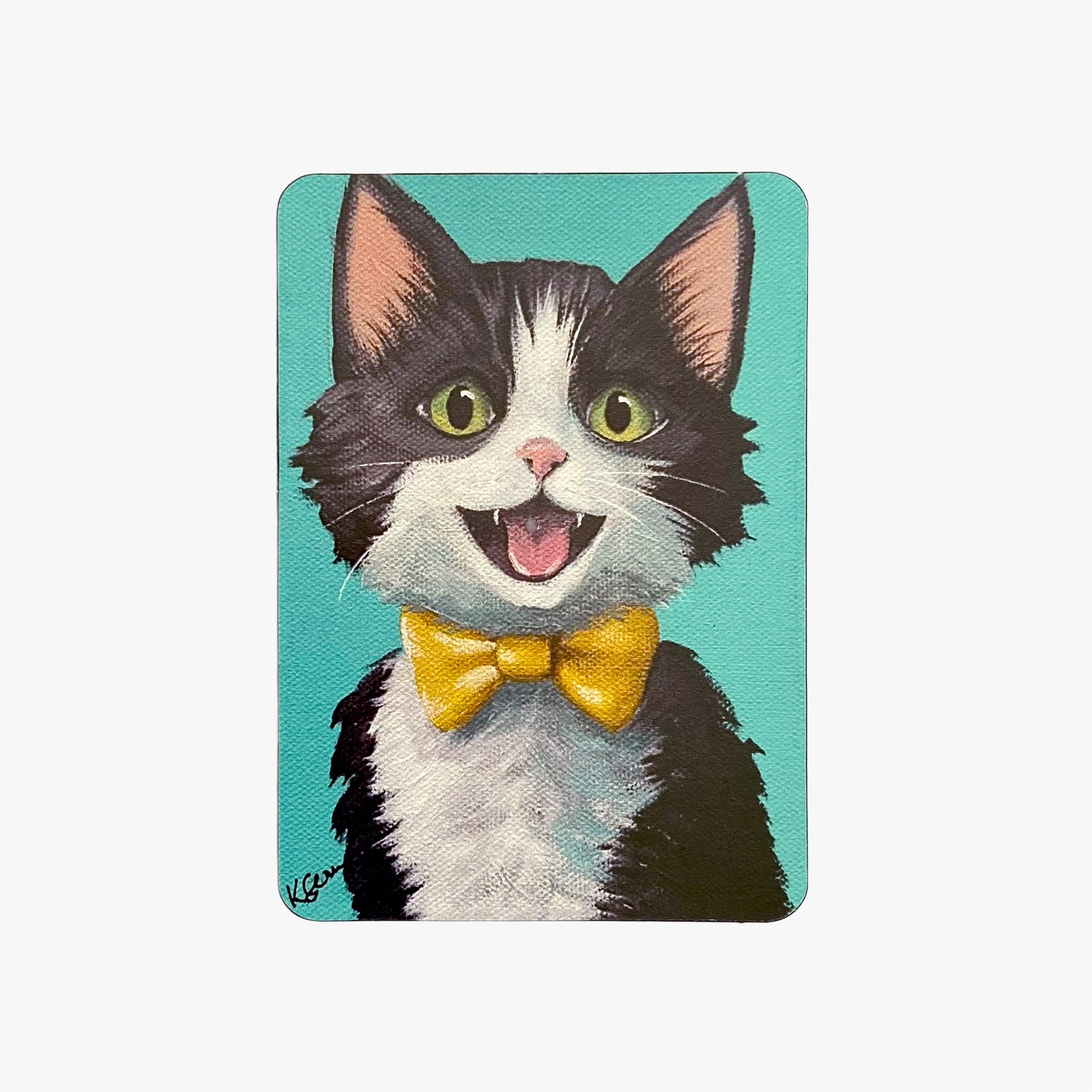 Magnet with a cartoon cat wearing a yellow bow tie on a teal background