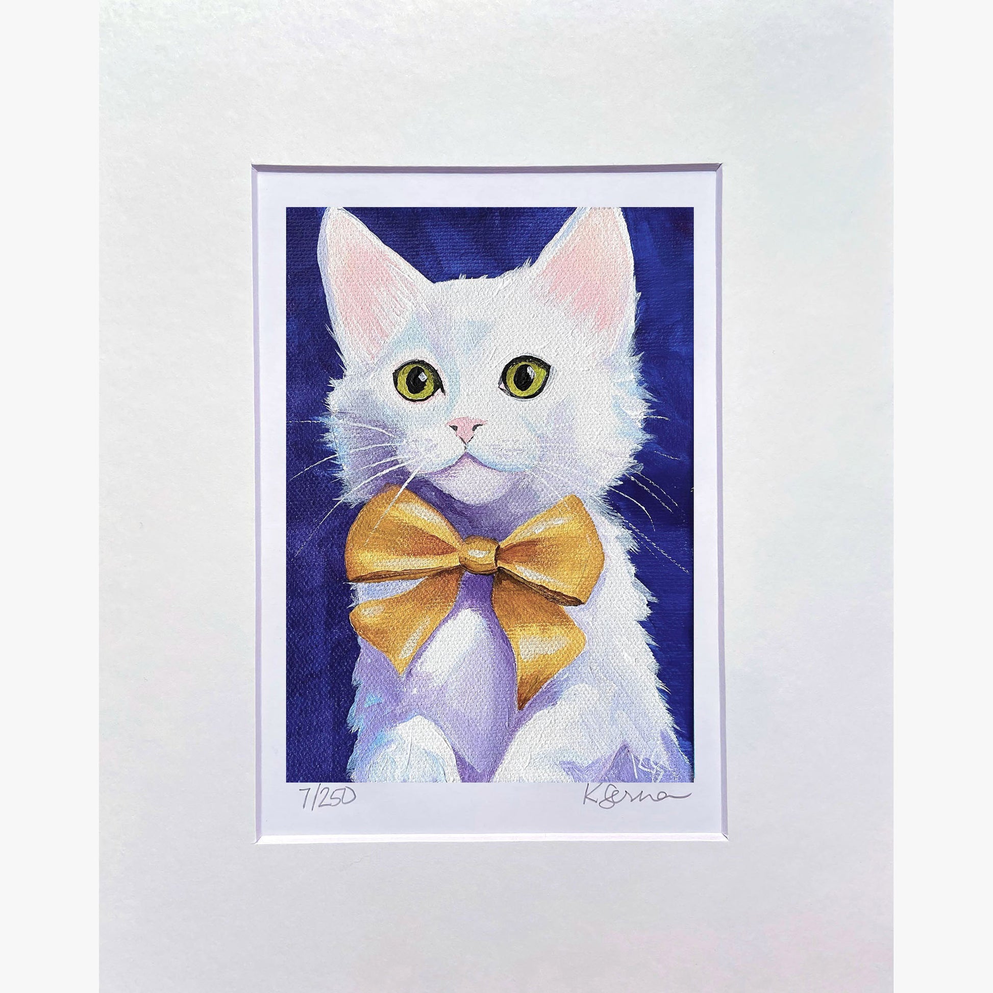 Framed artwork of a white cat with a gold bow tie on a blue background