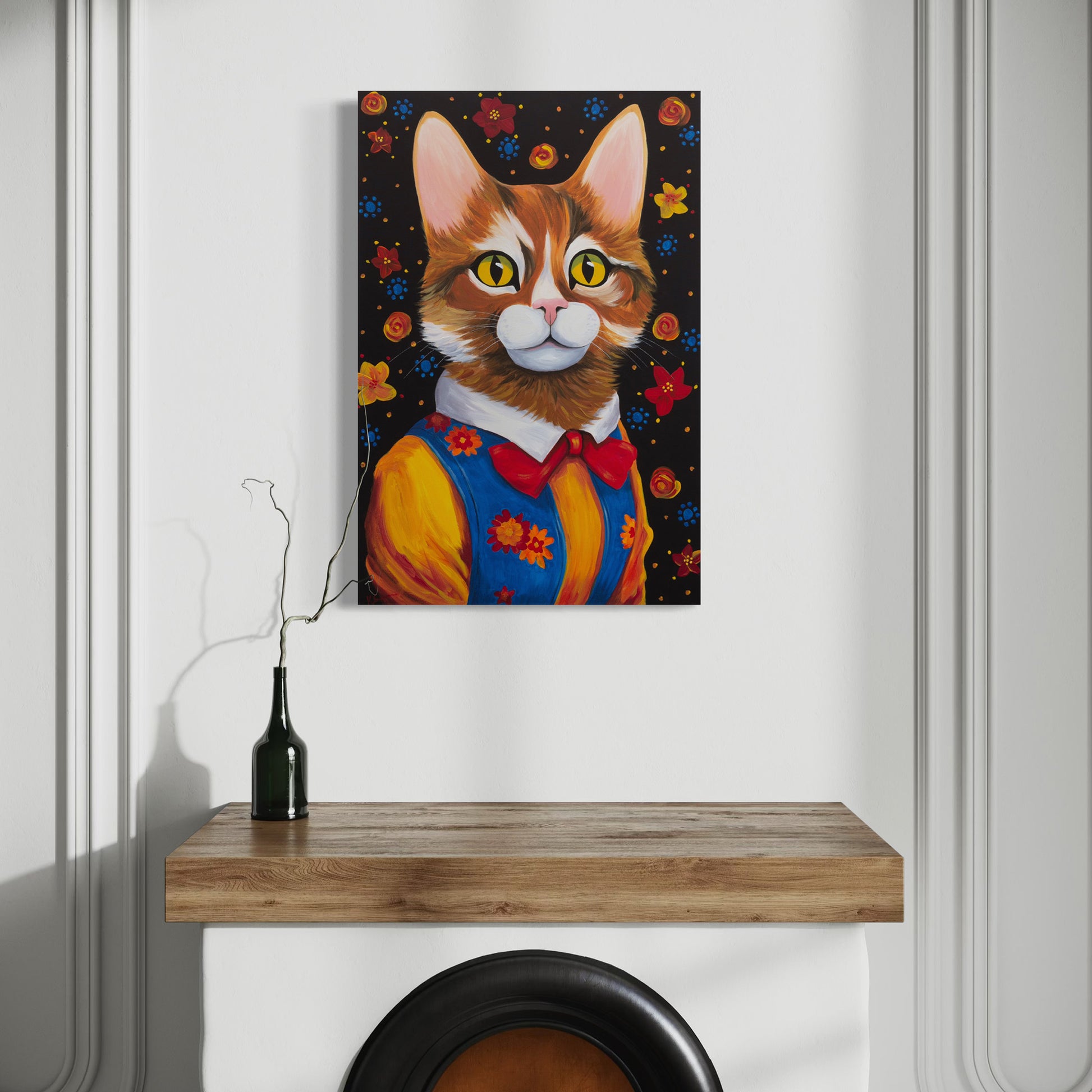 A stylish, colorful painting of Maisie, the expressive tabby cat, adorning a modern interior with a wooden mantel and sleek decor.