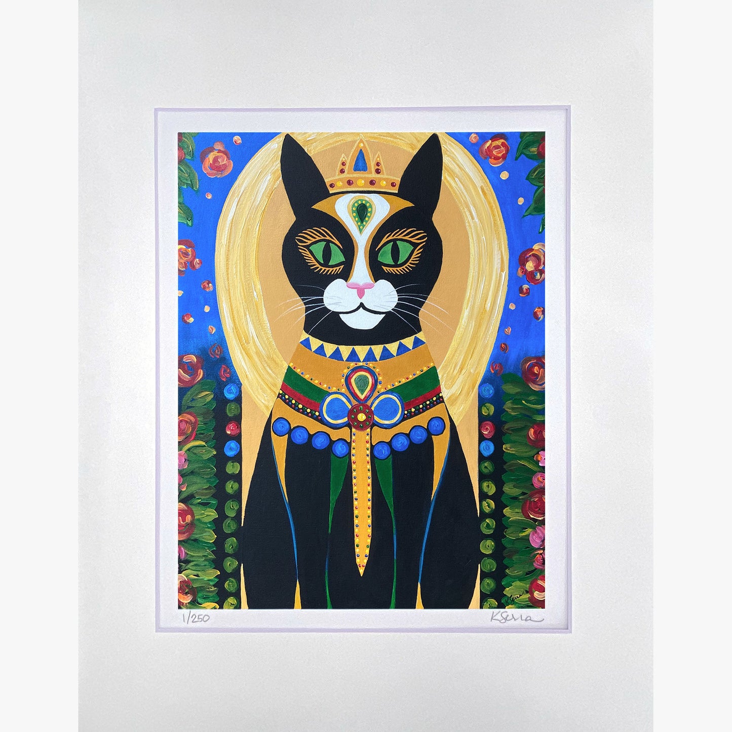 A close-up of a limited edition print featuring Shadow the Cat, a mystical black feline dressed in a richly decorated robe with golden embellishments. A glowing golden halo surrounds their head, and a bejeweled collar adds a regal touch. The background is deep blue with floral vines climbing along the edges. The print is matted with a white border, with the artist’s signature and edition number (1/250) visible at the bottom.