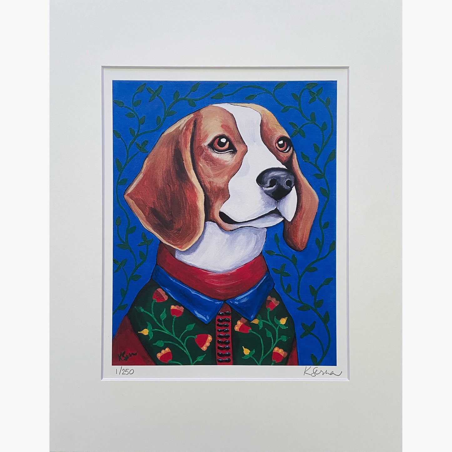 A close-up of a limited edition print featuring Theo the Beagle, a charming and mischievous dog with warm brown eyes. Theo wears a green sweater decorated with small red and yellow flowers, paired with a blue-collared red shirt. The background is a rich blue with leafy green vines. The print is matted with a white border, and the artist's signature and edition number (1/250) are visible at the bottom.