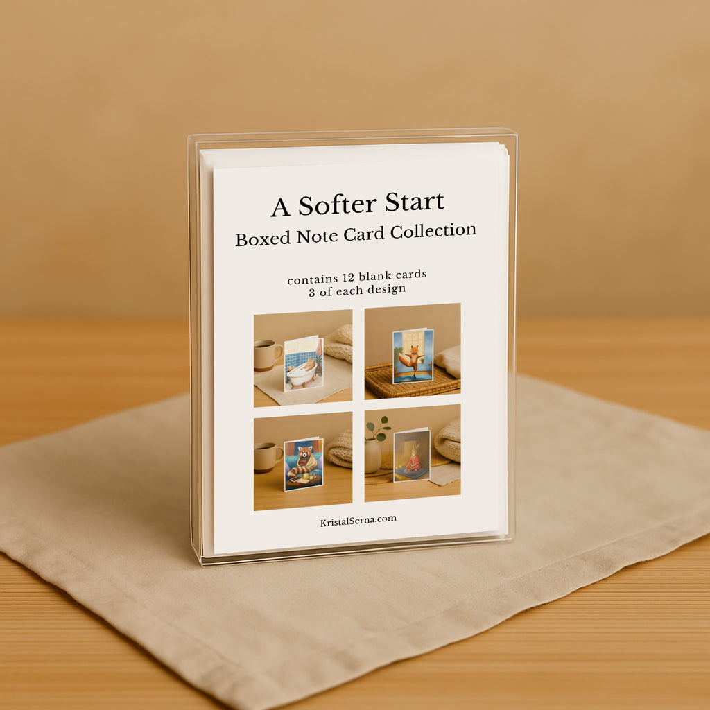 Boxed note card collection with images on a beige surface and brown background