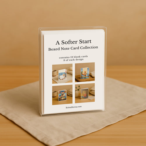 Boxed note card collection with images on a beige surface and brown background
