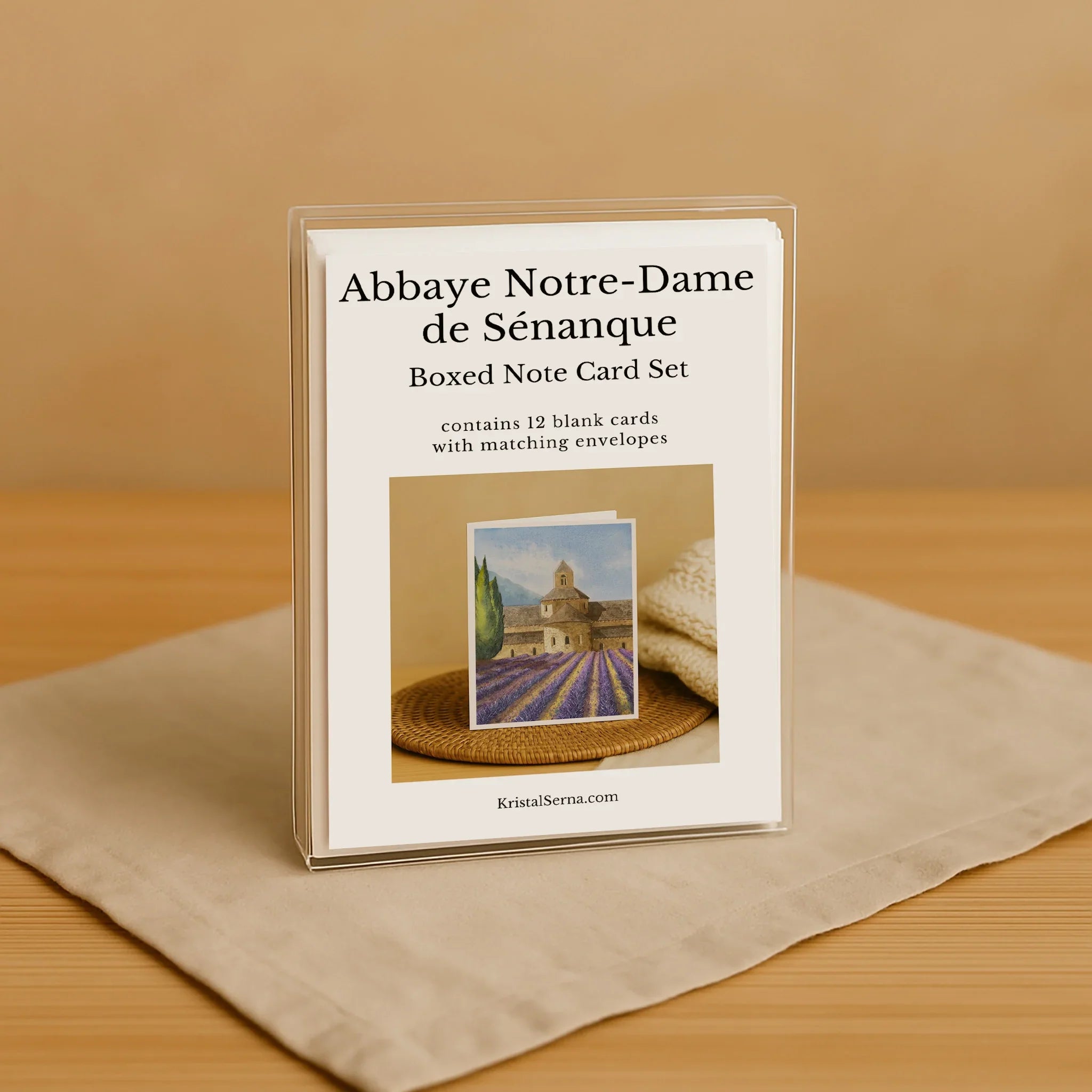 Boxed note card set with a scenic image on a beige surface