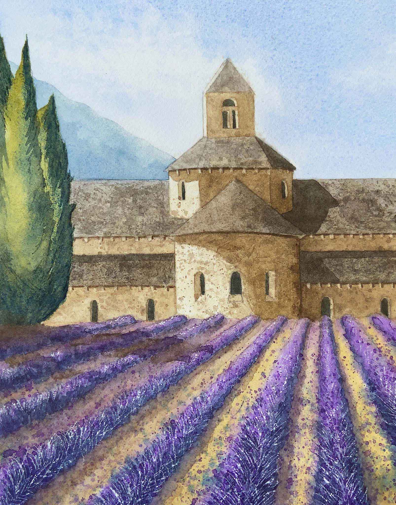 Stone building with a bell tower and lavender fields in the foreground