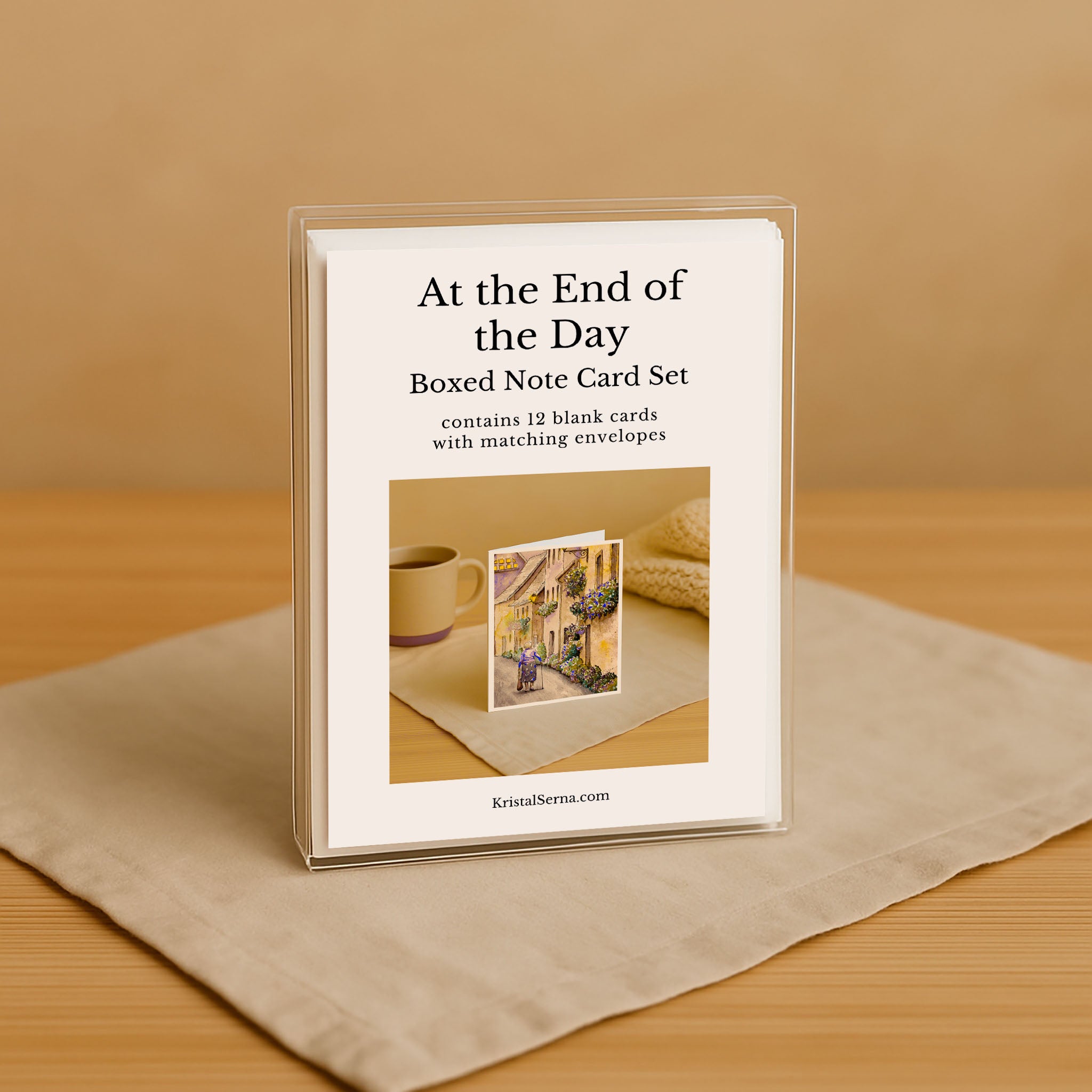 Boxed note card set with a cover featuring a coffee cup and envelope on a beige surface.