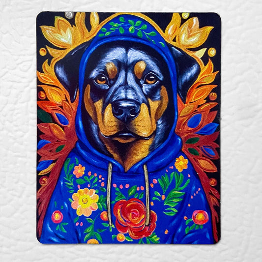 Colorful painting of a dog in a blue hoodie surrounded by flowers and leaves on a textured white background