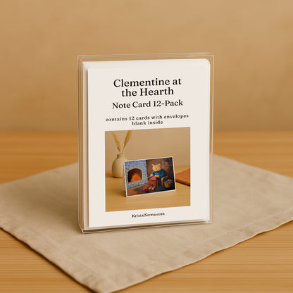 Note card set packaging titled 'Clementine at the Hearth' on a beige surface.