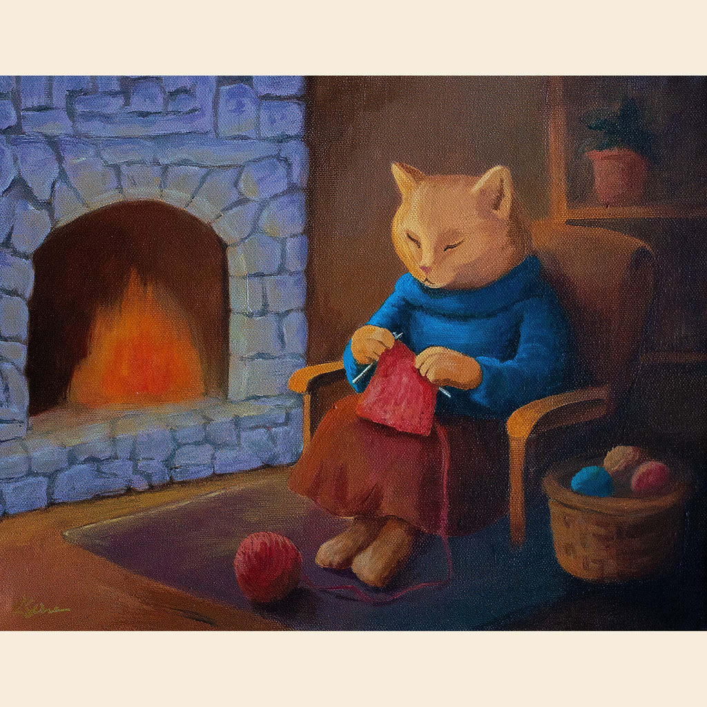 Cat in a blue sweater knitting by a fireplace