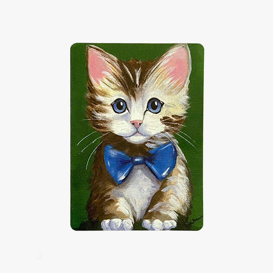 Painting of a kitten with a blue bow tie on a green background