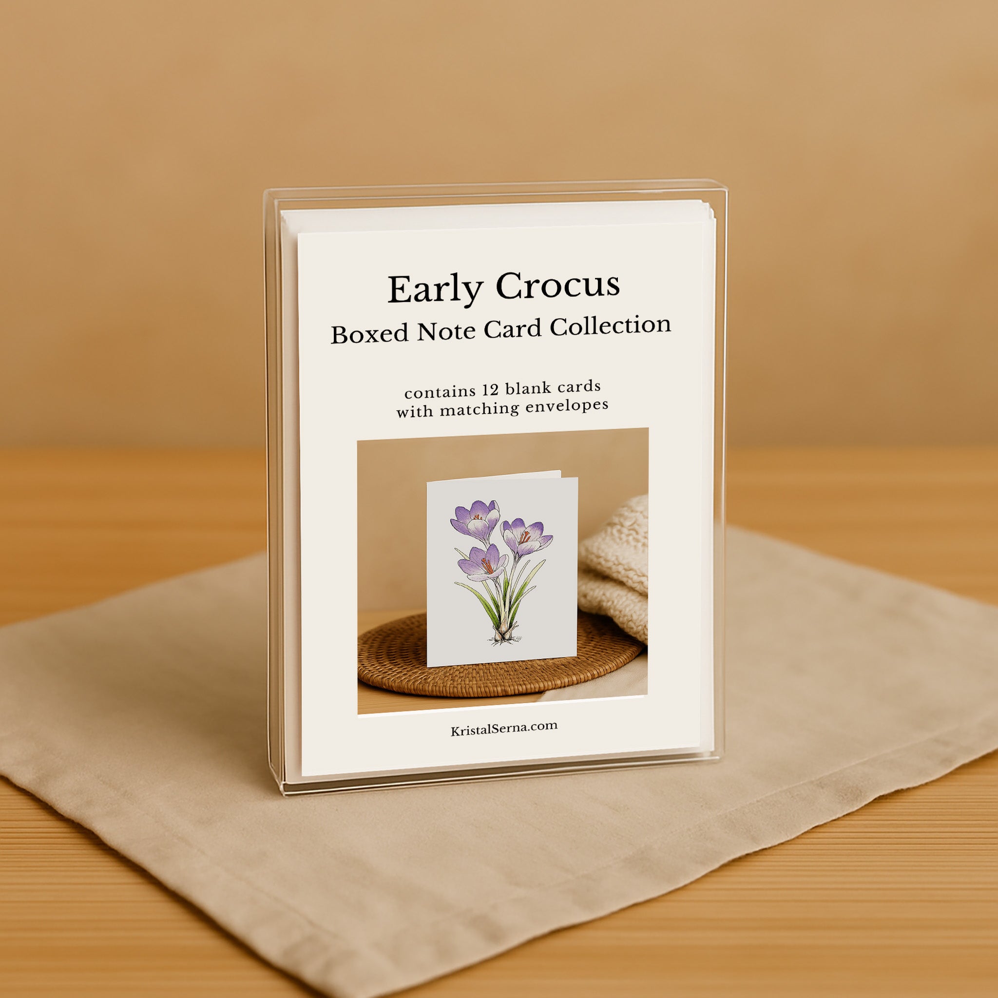 Boxed note card collection with a floral design on a beige surface