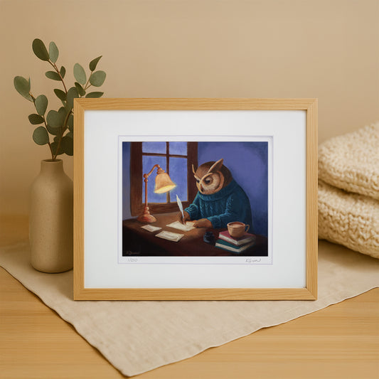 Framed artwork of an owl character writing a letter by a lamp on a wooden table.