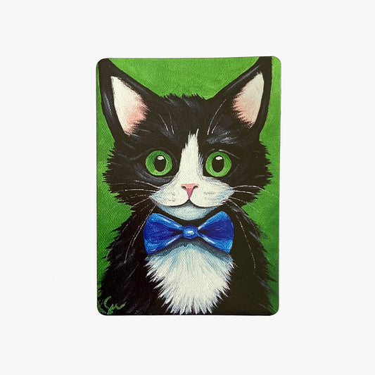 Illustration of a black and white cat with a blue bow tie on a green background
