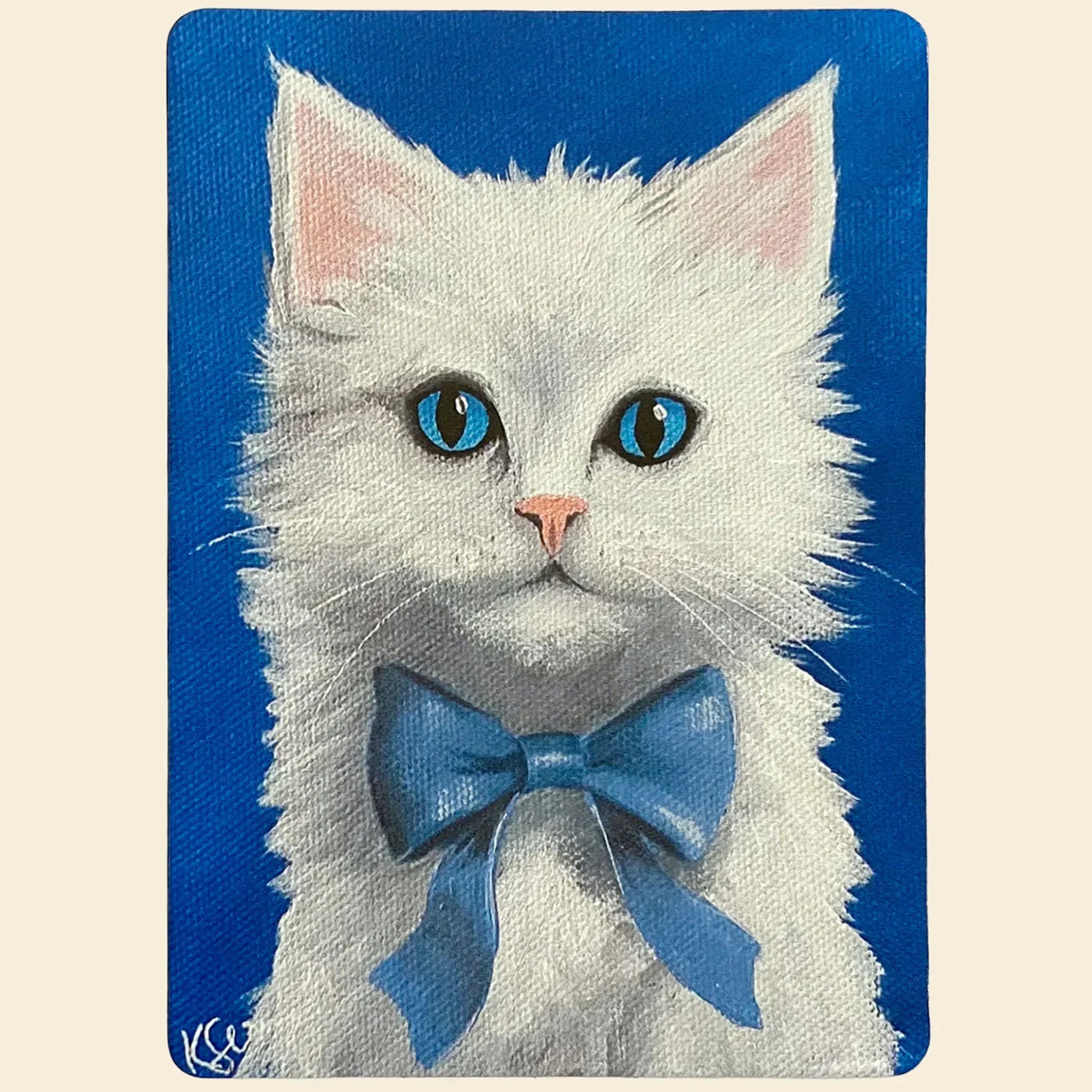White cat with blue bow tie on a blue background