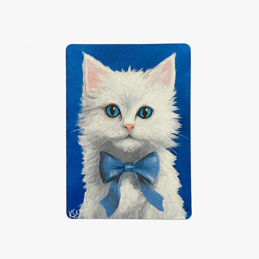 Painting of a white cat with blue eyes and a blue bow tie on a blue background