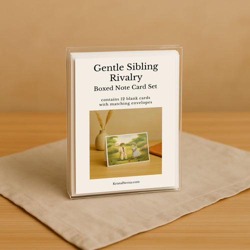 Boxed note card set titled 'Gentle Sibling Rivalry' on a beige surface with a brown background
