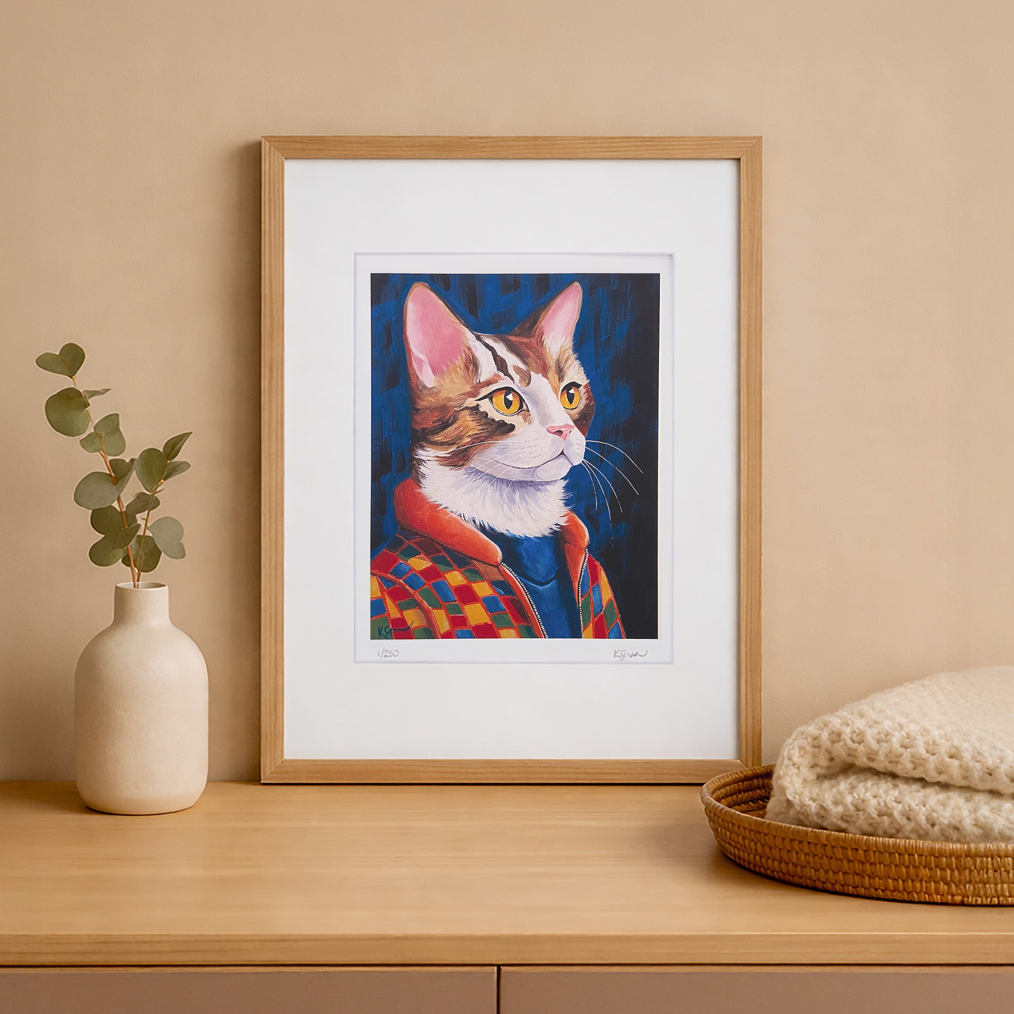 Framed artwork of a cat on a wooden shelf with decorative items.