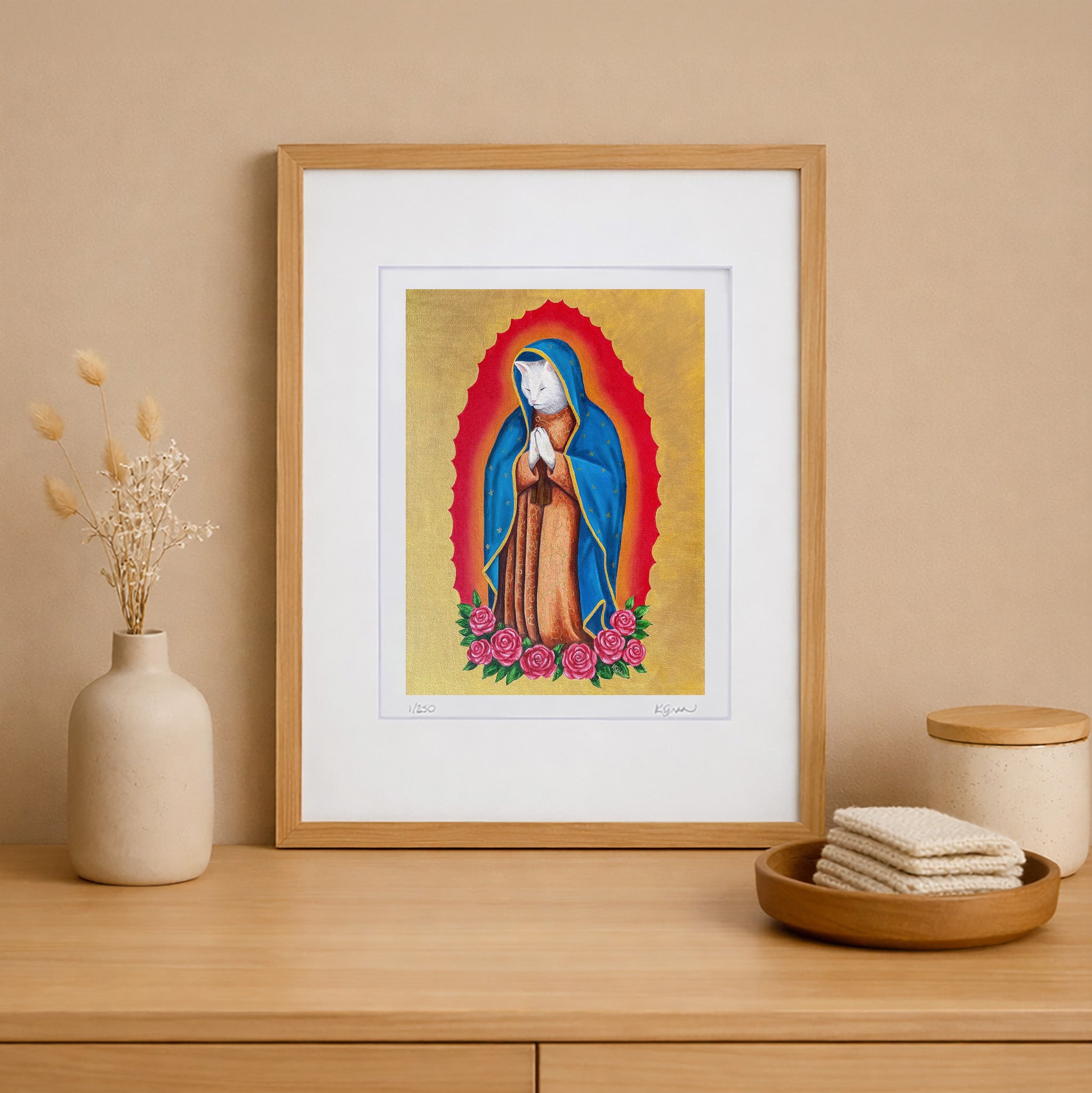 Framed artwork of a religious figure on a wooden shelf with decorative items.