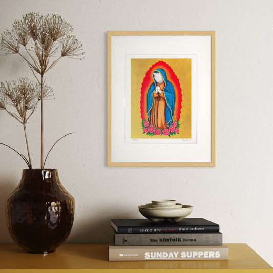 Framed artwork of a religious figure on a shelf with books and a vase.