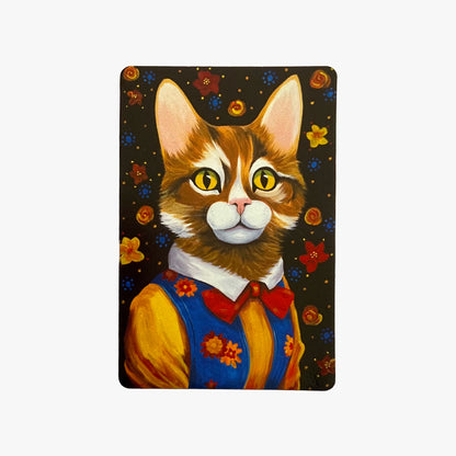 Painting of a cat with a colorful outfit on a dark background with flowers