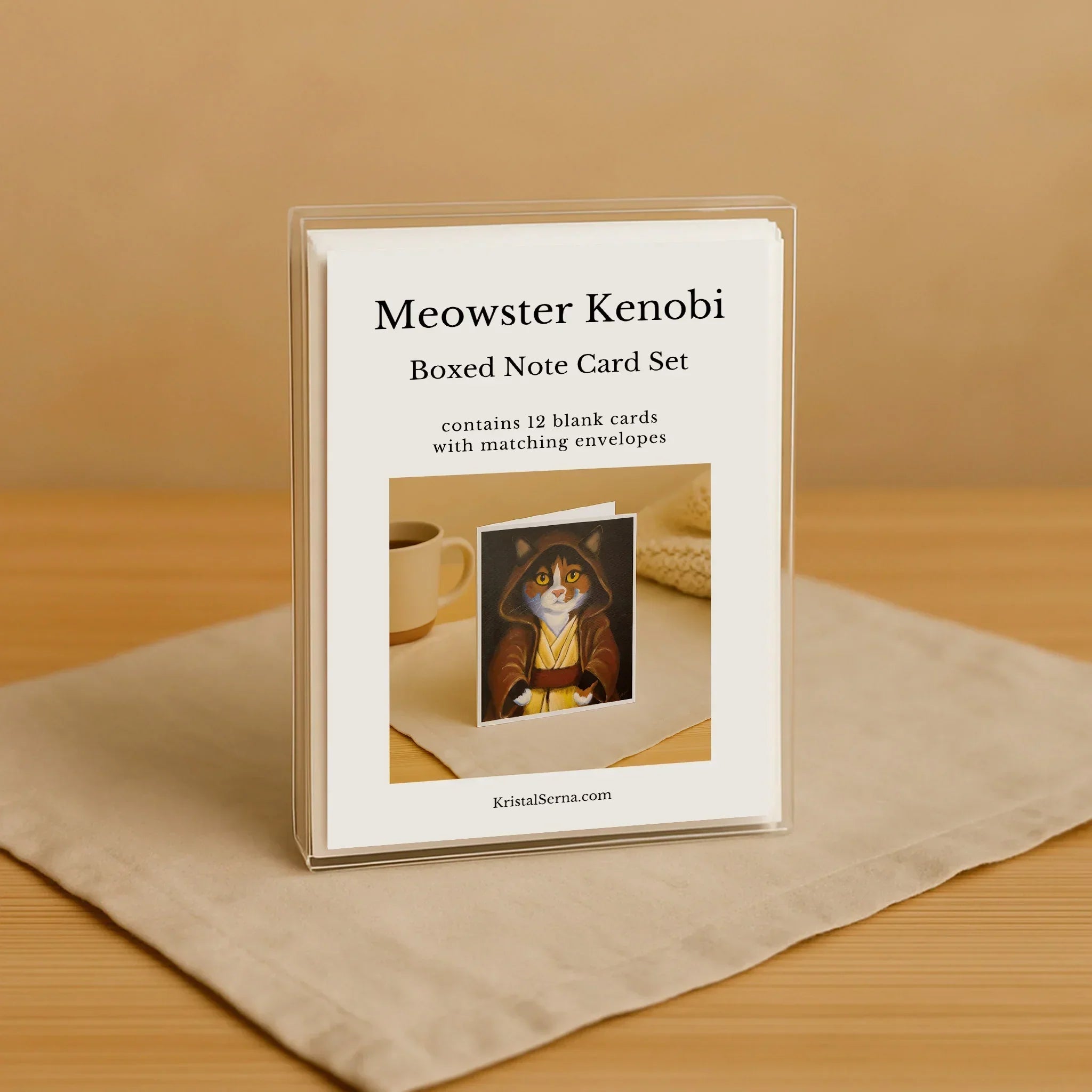 Meowster Kenobi boxed note card set on a wooden surface with a beige background