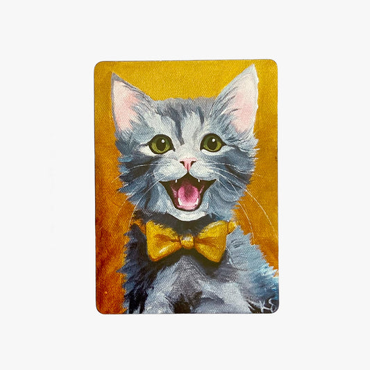 Painting of a cat with a yellow bow tie on a mustard yellow background