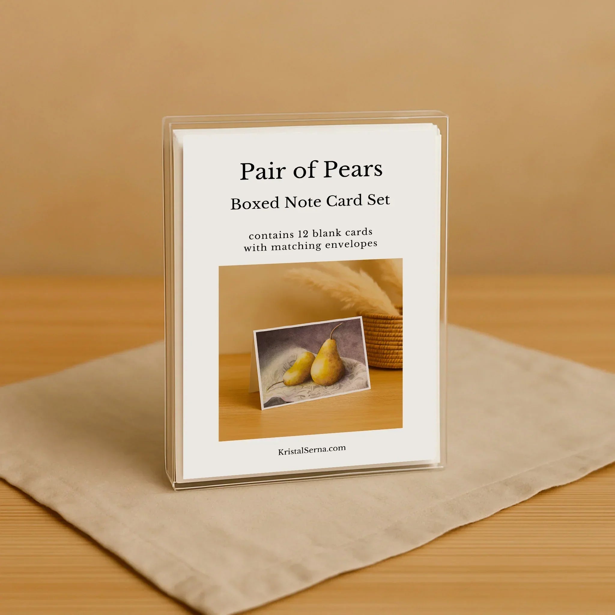 Note card set packaging with pears on a beige background