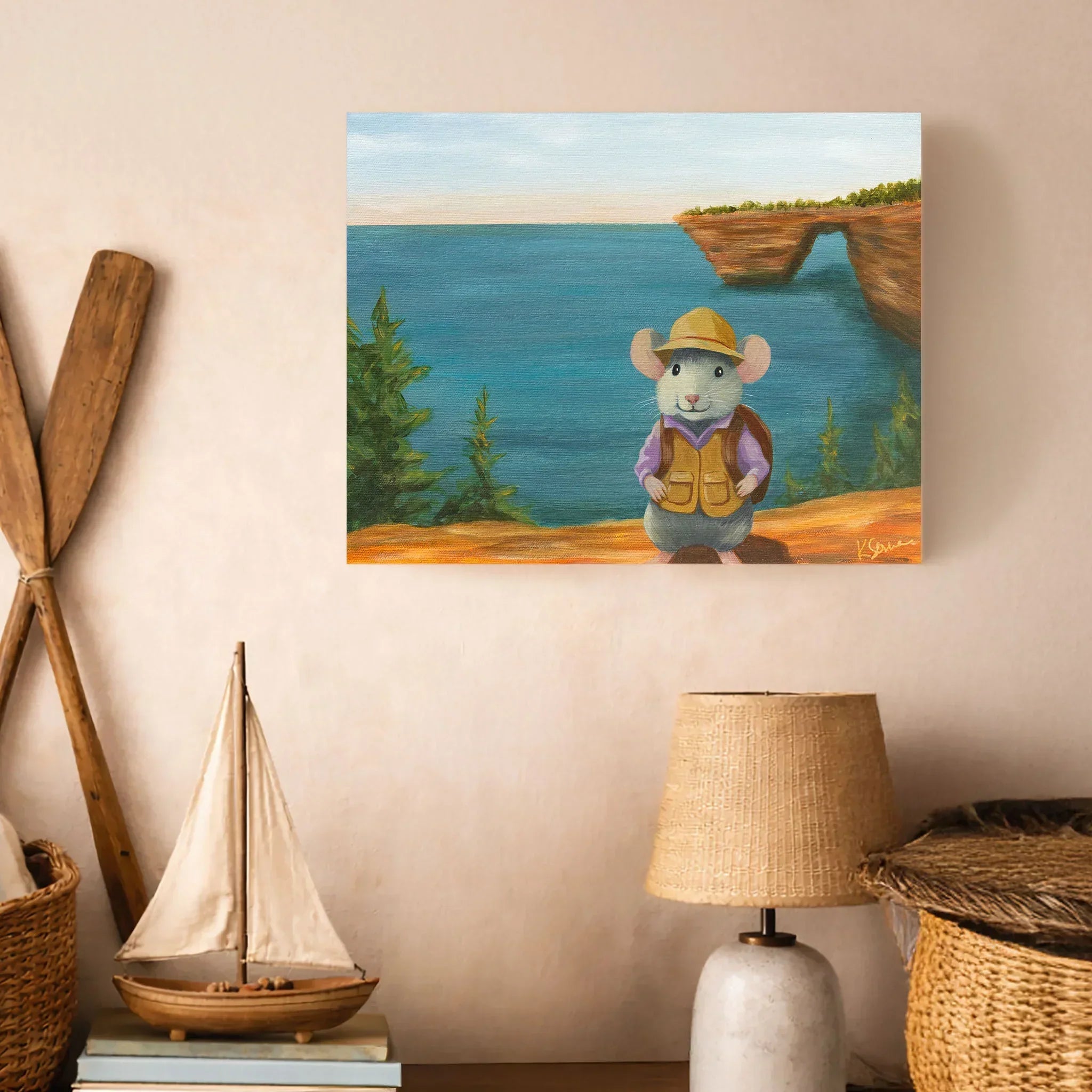 Painting of a mouse character with a hat and vest at Pictured Rocks National Seashore, displayed on a wall with decorative items.