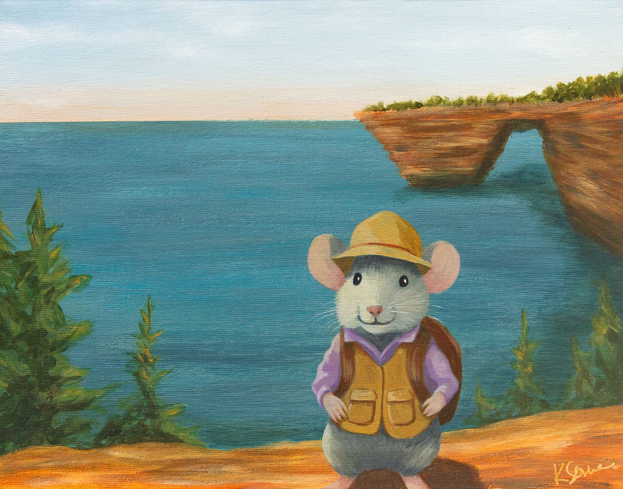 A mouse posing for a photo with Pictured Rocks National Seashore in the background