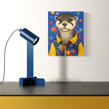Canvas print of an otter wearing a yellow shirt with flowers on a white wall, next to a blue lamp.