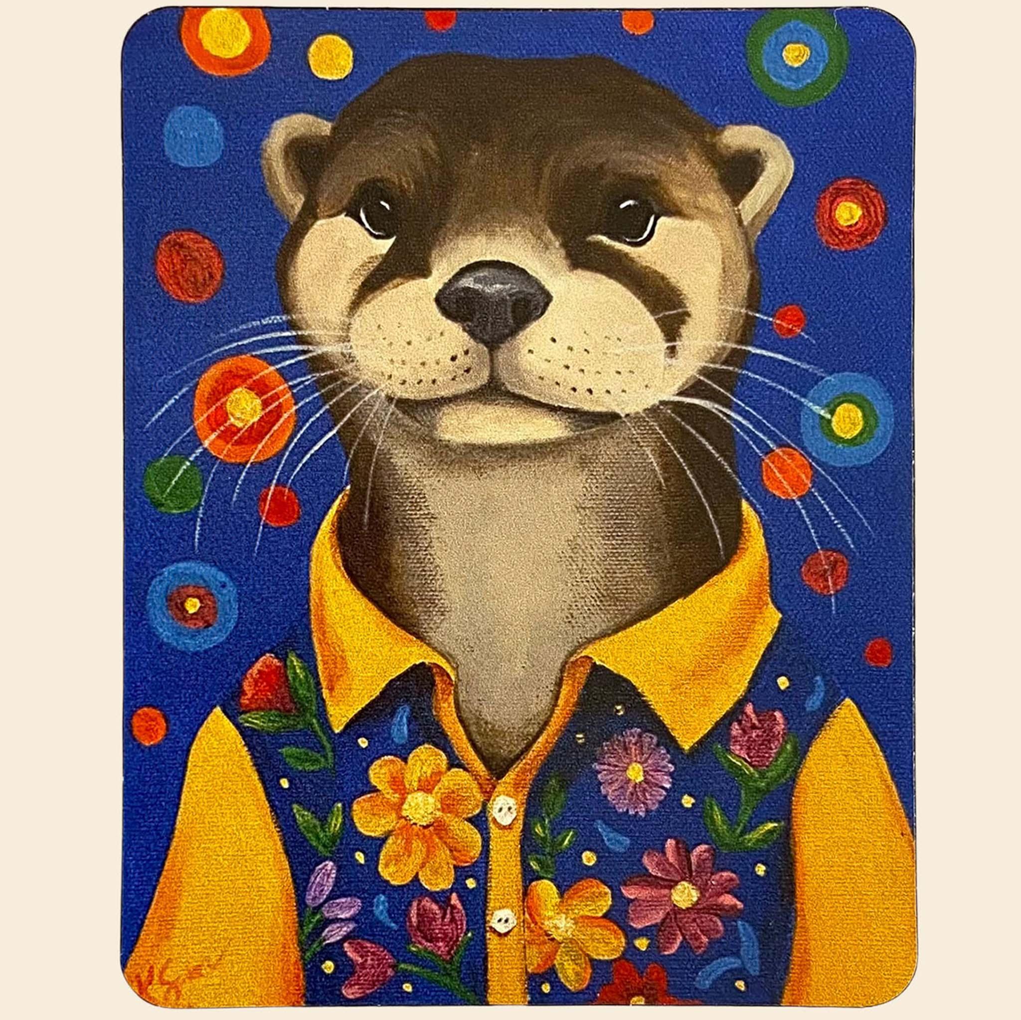 Magnet of an otter wearing a yellow shirt with floral patterns on a blue background with colorful circles.