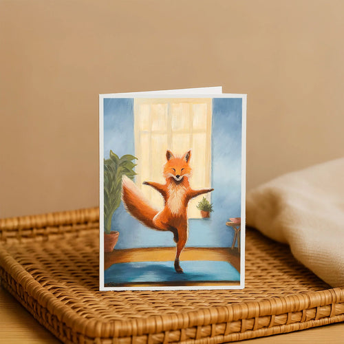 Greeting card with a fox doing yoga on a blue mat.