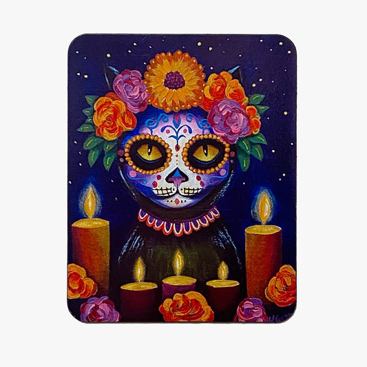 Colorful skull with floral crown and candles on a dark background