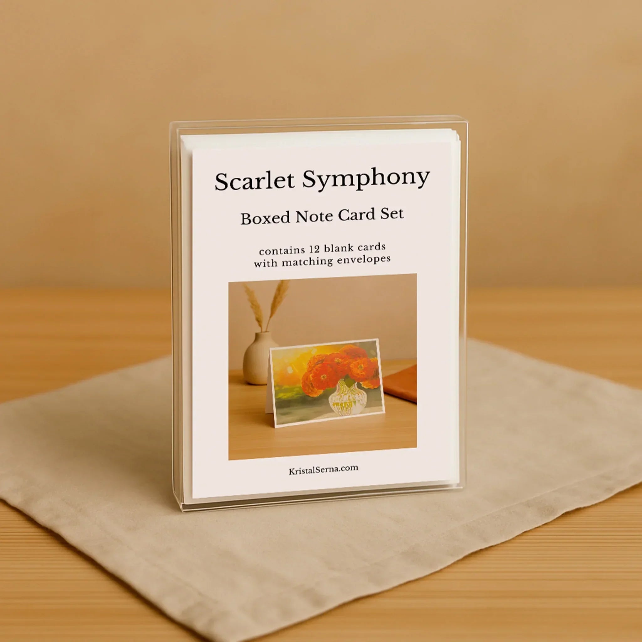 Scarlet Symphony boxed note card set on a beige surface with a wooden background