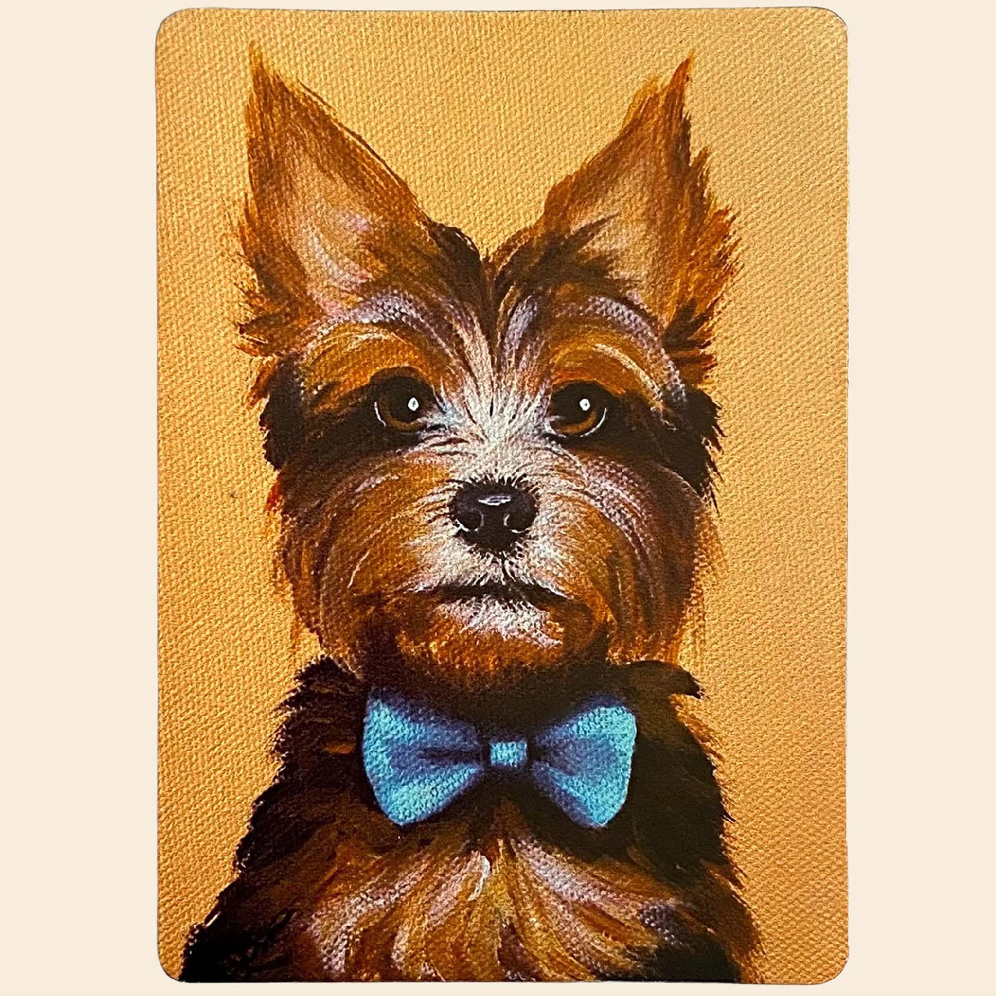 Magnet of a dog with a blue bow tie on a yellow background