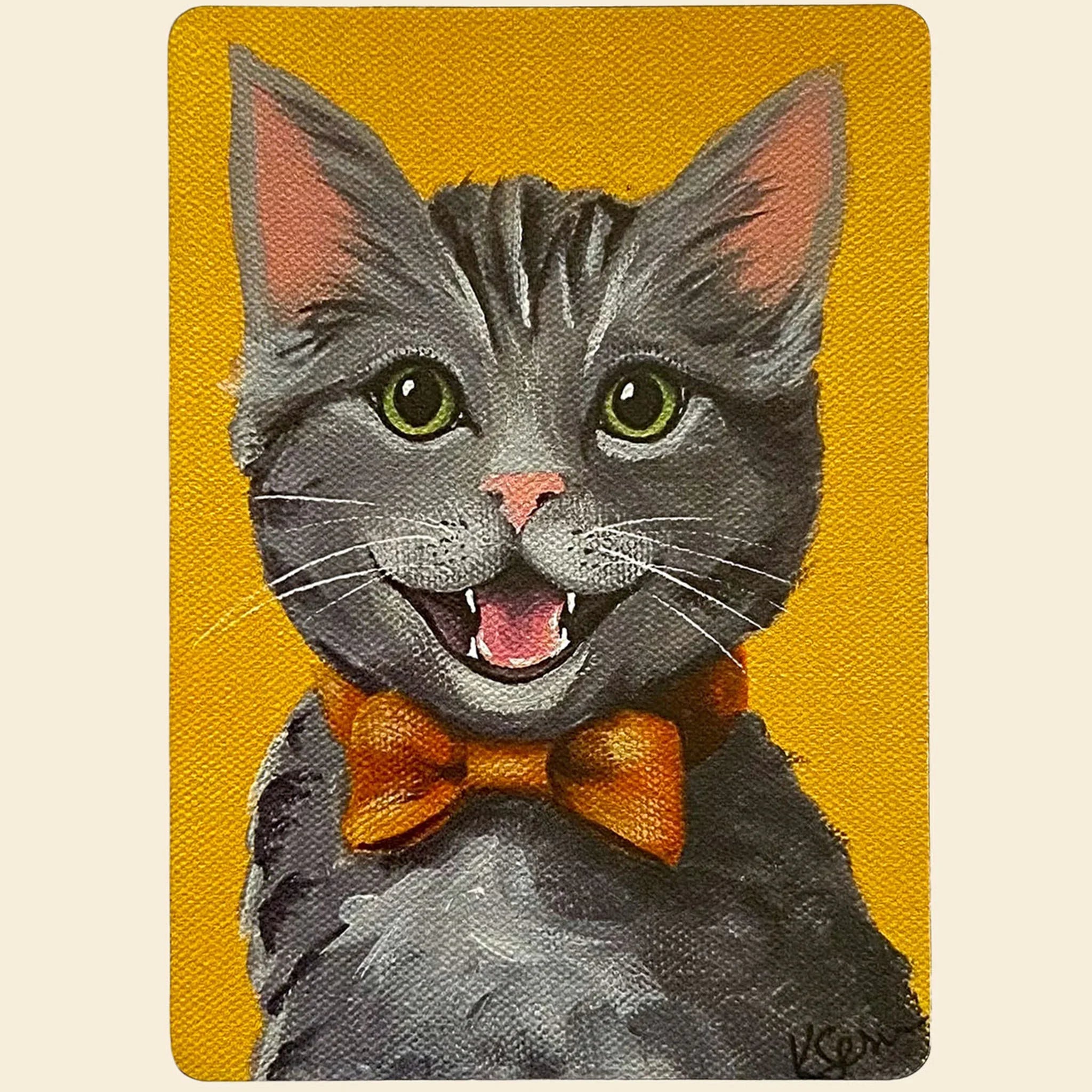 Magnet of a gray cat with a yellow bow tie on a yellow background