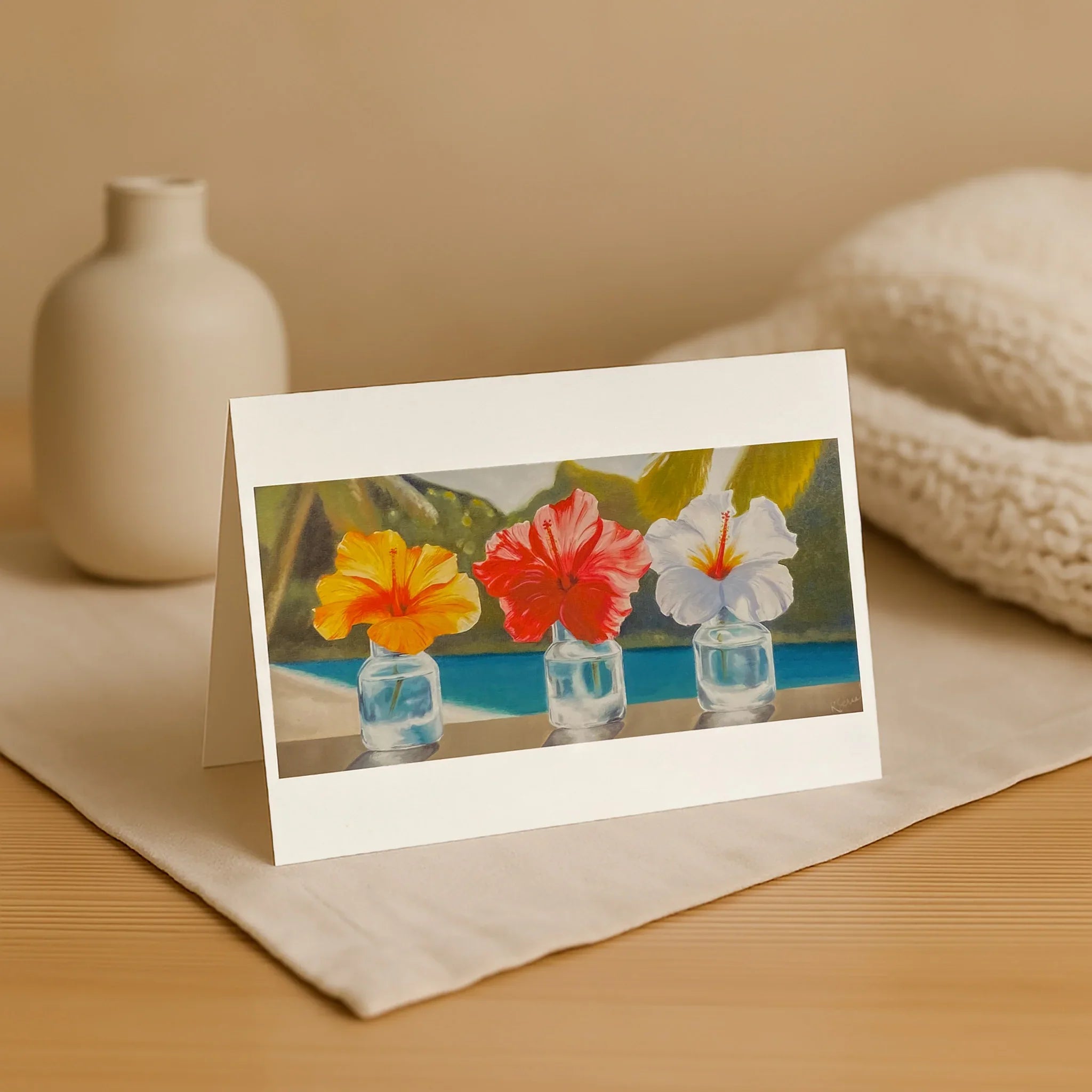Greeting card with floral design on a wooden surface