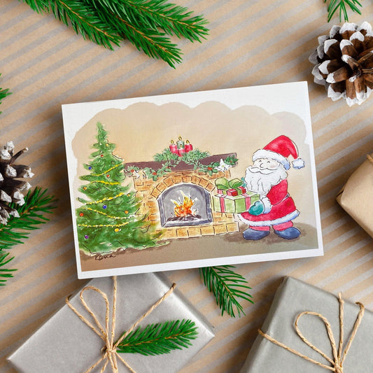 A watercolor and ink painting of Santa placing presents beside a decorated Christmas tree and a fireplace with candles and garland above the mantel.