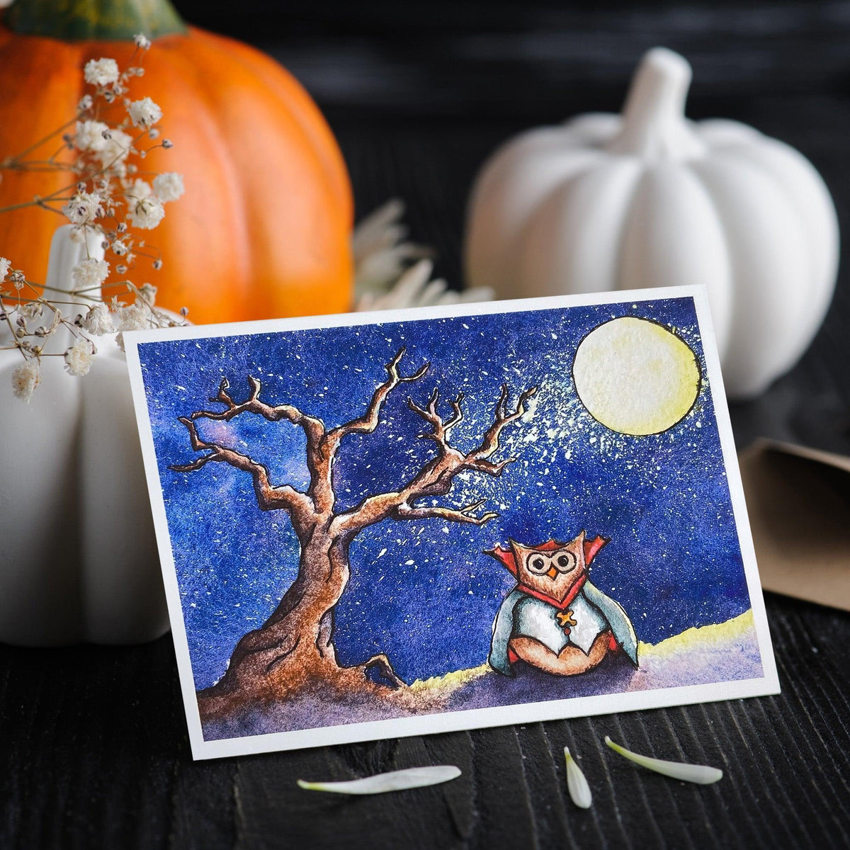greeting card of owl dressed as vampire