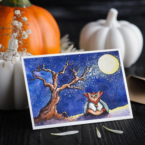 greeting card of owl dressed as vampire